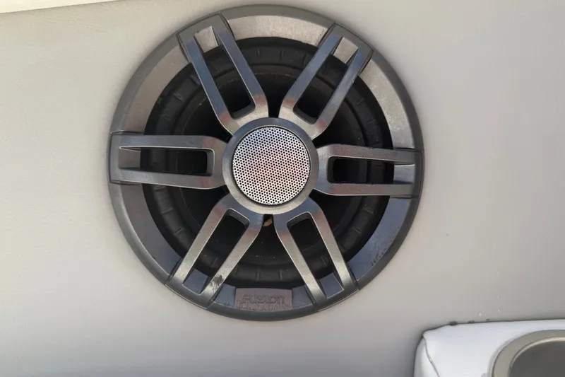 Slide: The Image of Close-up of a Fusion speaker in a 2022 Regal LS2 boat. - 56