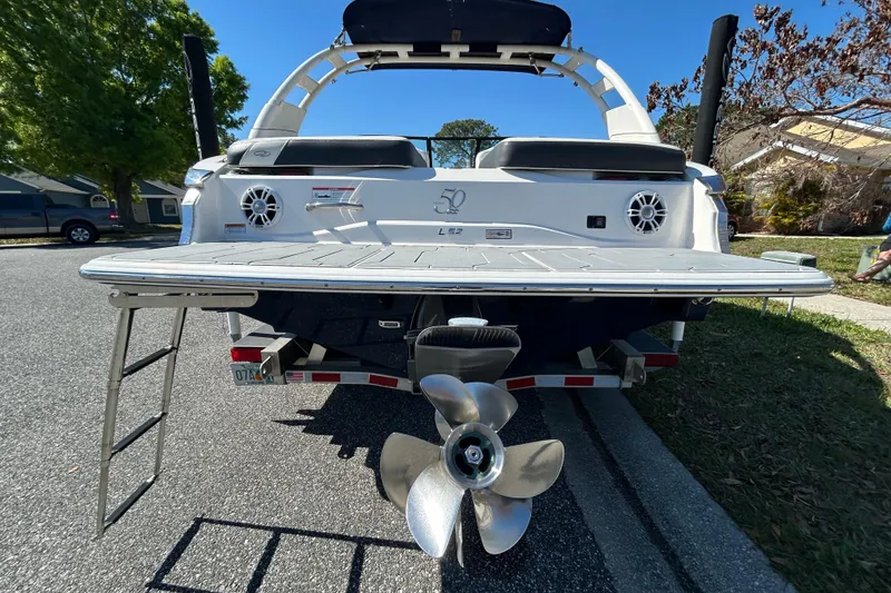 Slide: The Image of Rear view of 2022 Regal LS2 boat with swim platform and propeller. - 8