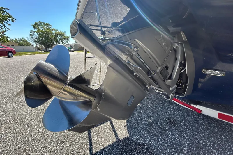 Slide: The Image of 2022 Regal LS2 boat propeller and outdrive in a sunny outdoor setting. - 11