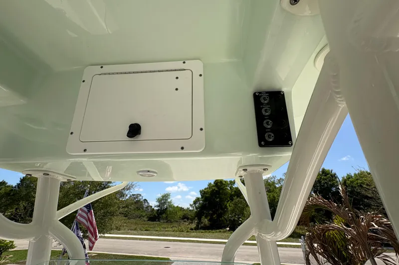 Slide: The Image of 2022 Sea Born LX22 Center Console boat's overhead console and control panel. - 19