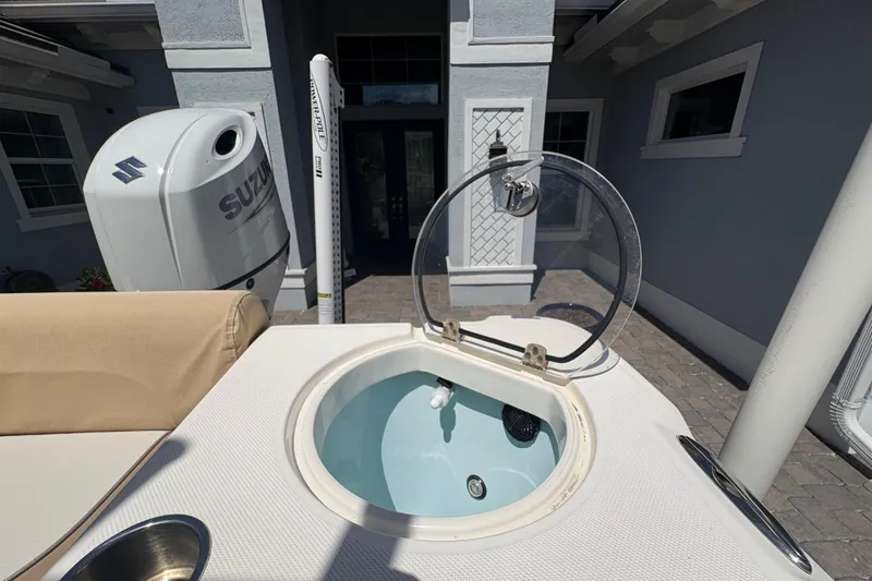 Slide: The Image of 2022 Sea Born LX22 Center Console boat with Suzuki engine and open livewell. - 28