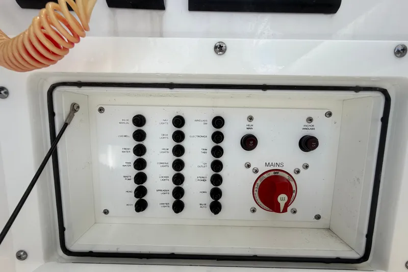 Slide: The Image of Control panel of 2023 Edgewater 248CX Crossover boat with switches and mains dial. - 49