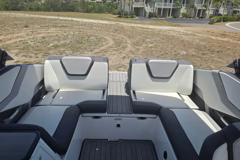 Slide: The Image of 2022 Yamaha Boats 252SD interior seating with modern design and spacious layout. - 75