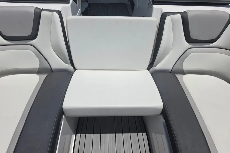 Slide: The Image of 2022 Yamaha Boats 252SD interior seating with sleek, modern design and comfortable upholstery. - 58