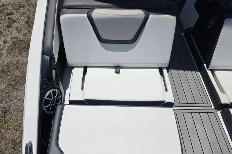 Slide: The Image of 2022 Yamaha Boats 252SD interior seating with sleek design and integrated speaker. - 16