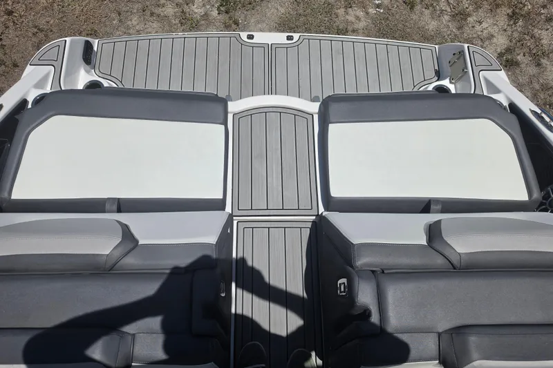 Slide: The Image of 2022 Yamaha Boats 252SD swim platform with cushioned seating and gray decking. - 72