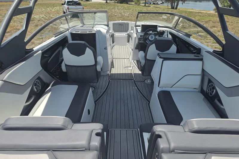 Slide: The Image of 2022 Yamaha Boats 252SD interior with sleek seating and modern dashboard design. - 21