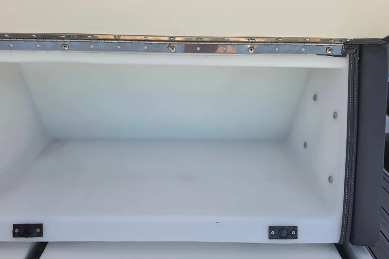 Slide: The Image of Storage compartment of 2022 Yamaha Boats 252SD, featuring a spacious interior and secure fittings. - 17