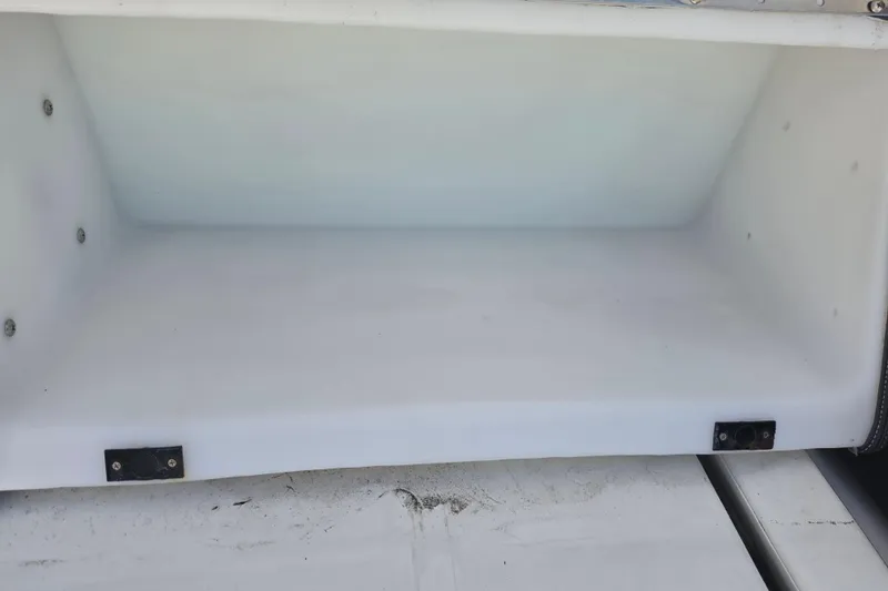 Slide: The Image of Storage compartment of a 2022 Yamaha Boats 252SD, showcasing spacious interior design. - 19