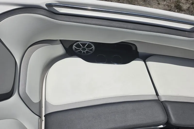 Slide: The Image of Interior seating of 2022 Yamaha Boats 252SD with speaker and cup holders. - 55