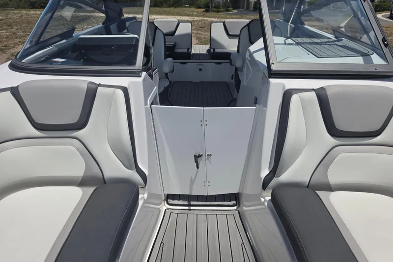 Slide: The Image of 2022 Yamaha Boats 252SD interior with sleek seating and open cockpit view. - 61