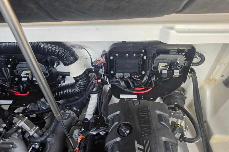 Slide: The Image of Engine compartment of 2022 Yamaha Boats 252SD, showcasing wiring and components. - 92