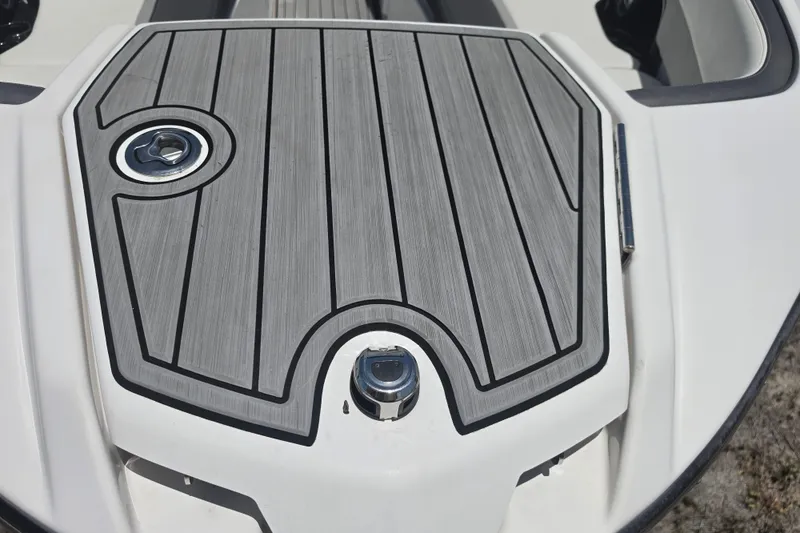 Slide: The Image of 2022 Yamaha Boats 252SD swim platform with sleek gray decking and chrome details. - 68