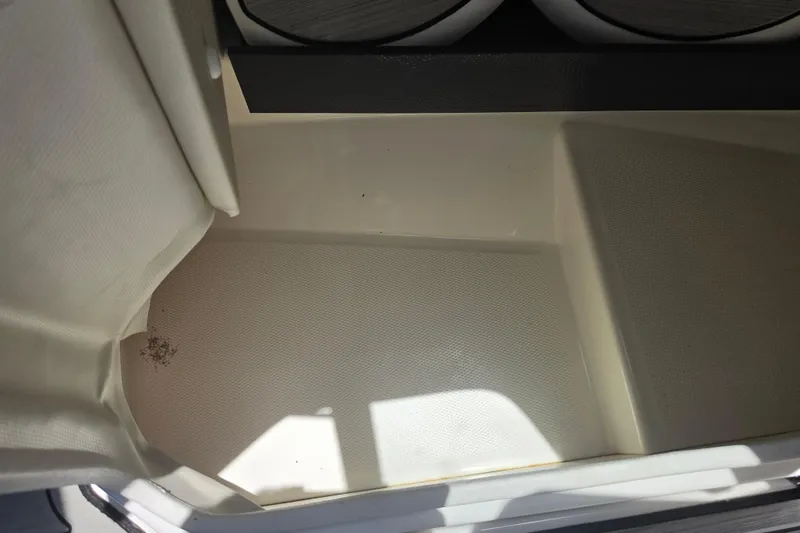 Slide: The Image of Interior view of a 2022 Yamaha Boats 252SD, showcasing textured flooring. - 49