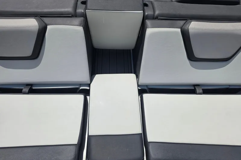 Slide: The Image of 2022 Yamaha Boats 252SD interior seating, featuring sleek gray and black upholstery design. - 87
