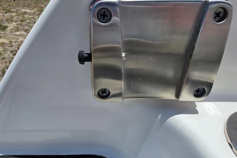 Slide: The Image of Close-up of a 2022 Yamaha Boats 252SD stainless steel boat fitting. - 97