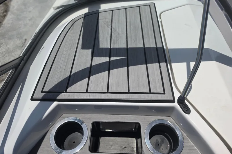 Slide: The Image of 2022 Yamaha Boats 252SD deck with cup holders and sleek design. - 66