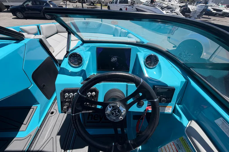 Slide: The Image of 2023 Heyday WTSurf boat dashboard with steering wheel and control panel. - 64
