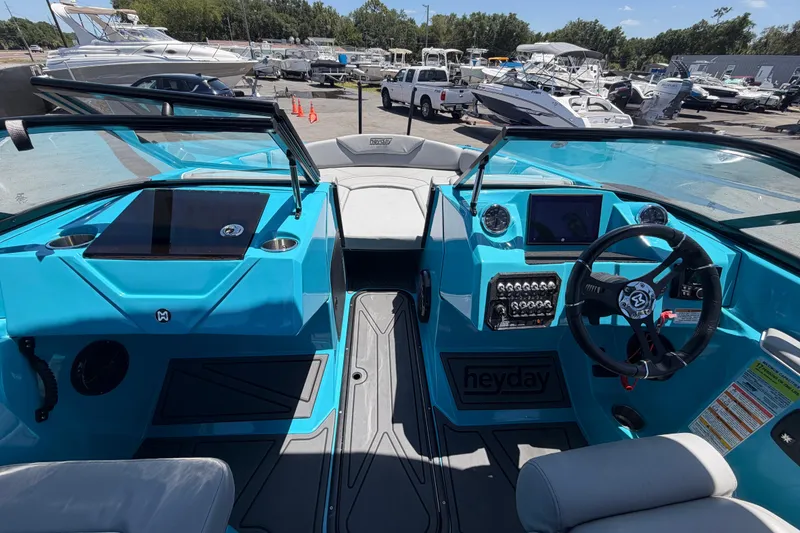 Slide: The Image of 2023 Heyday WTSurf boat interior with modern dashboard and steering wheel. - 75