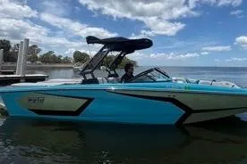 Slide: The Image of 2023 Heyday WTSurf boat on water under a partly cloudy sky. - 95