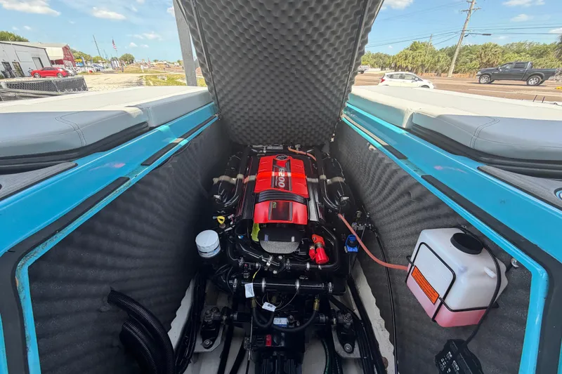 Slide: The Image of 2023 Heyday WTSurf boat engine compartment with red engine cover, open hatch. - 36
