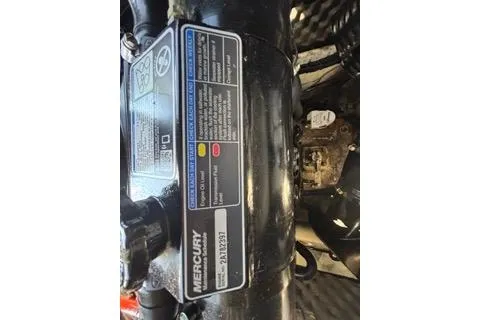Slide: The Image of Close-up of a 2023 Heyday WTSurf engine with Mercury branding and specifications label. - 38