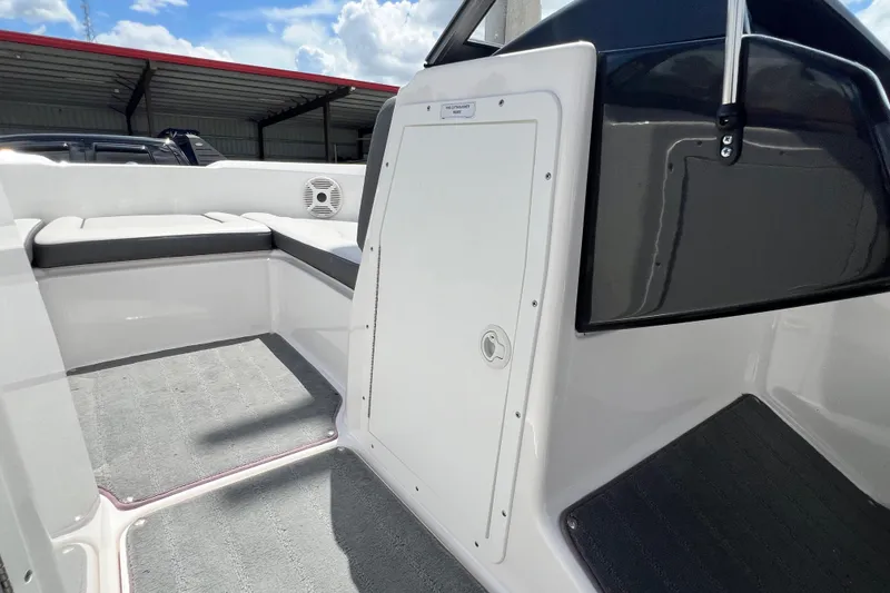 Slide: The Image of Interior view of 2022 Yamaha AR190 boat, featuring seating and storage compartment. - 34