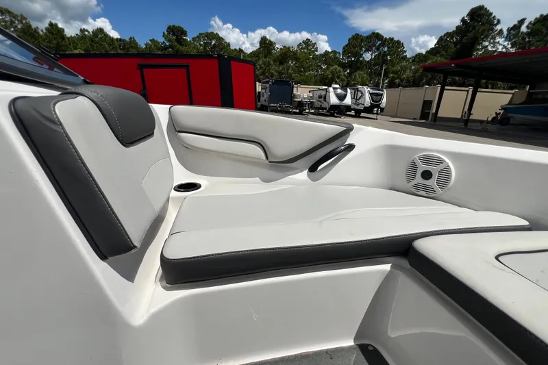 Slide: The Image of 2022 Yamaha AR190 boat interior with cushioned seating and speaker. - 40