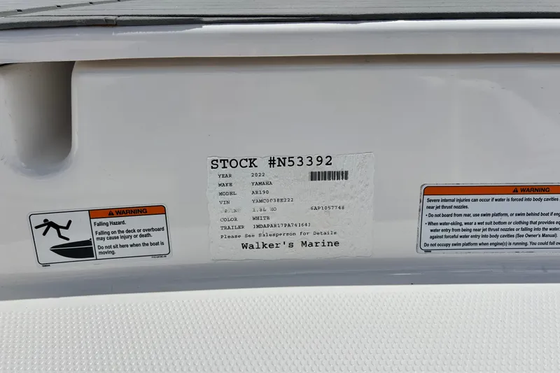 Slide: The Image of 2022 Yamaha Boats AR190 warning labels and stock information on white surface. - 53