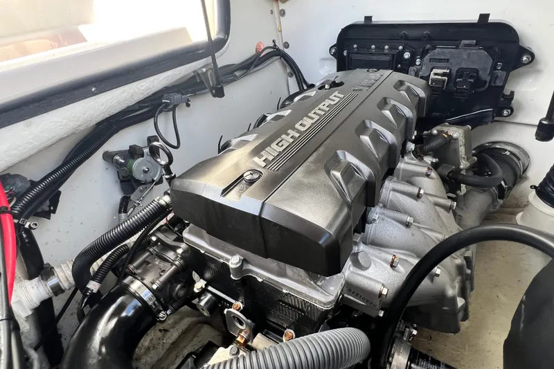 Slide: The Image of Engine compartment of a 2022 Yamaha Boats AR190, featuring a high-output engine. - 56