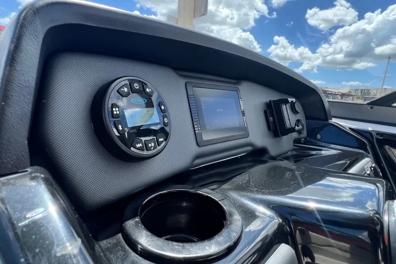 Slide: The Image of 2022 Yamaha AR190 dashboard with control panel and cup holder under a blue sky. - 36