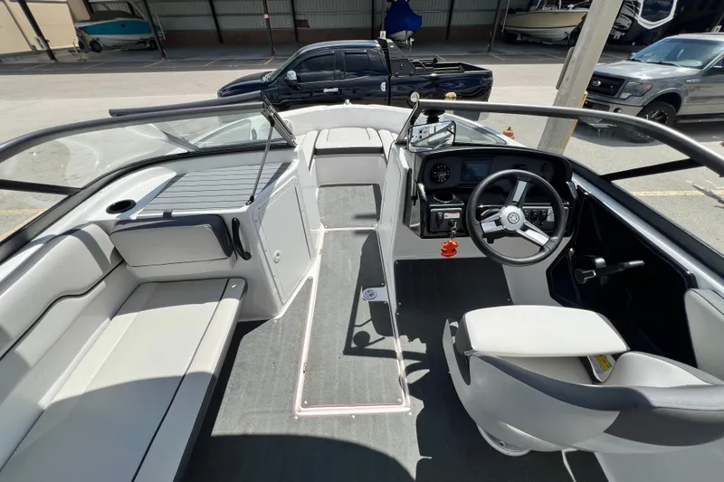 Slide: The Image of 2022 Yamaha Boats AR190 interior with steering wheel, seating, and dashboard controls. - 18