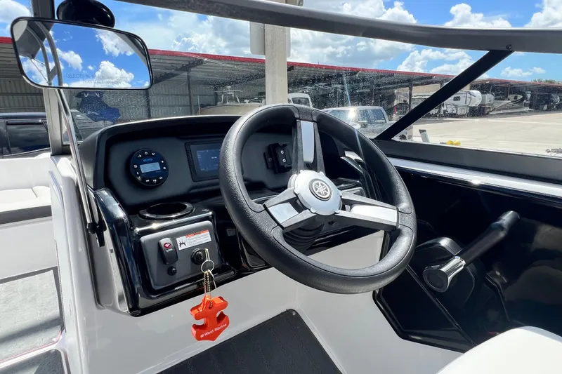 Slide: The Image of 2022 Yamaha Boats AR190 steering console with modern controls and dashboard. - 28
