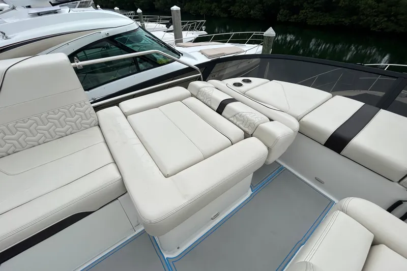 Slide: The Image of Luxurious seating area on 2023 Regal 38 FXO yacht with elegant white upholstery. - 26