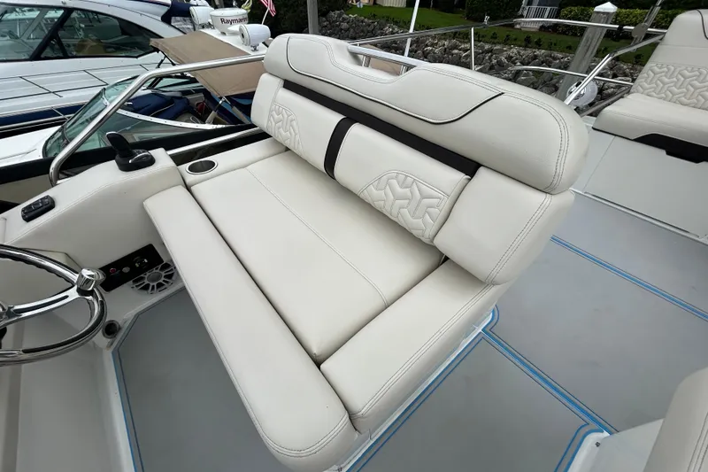 Slide: The Image of Luxurious seating on 2023 Regal 38 FXO boat, featuring elegant white upholstery and modern design. - 22