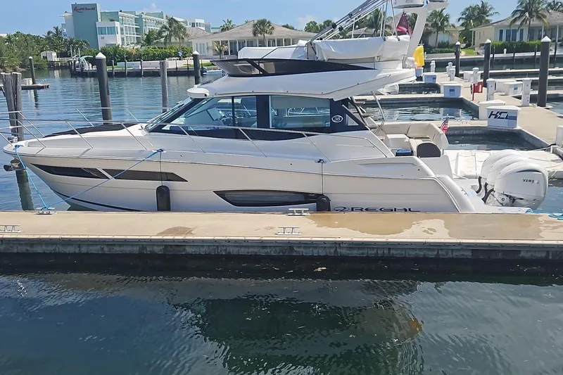 The Image of 2023 Regal 38 FXO yacht docked at marina, featuring sleek design and modern amenities. - 0