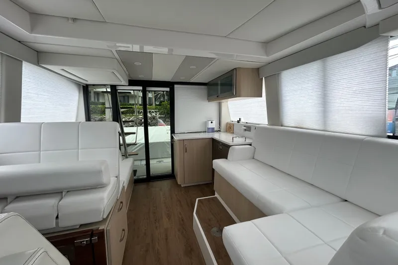 Slide: The Image of Luxurious interior of 2023 Regal 38 FXO yacht with white seating and modern design. - 76