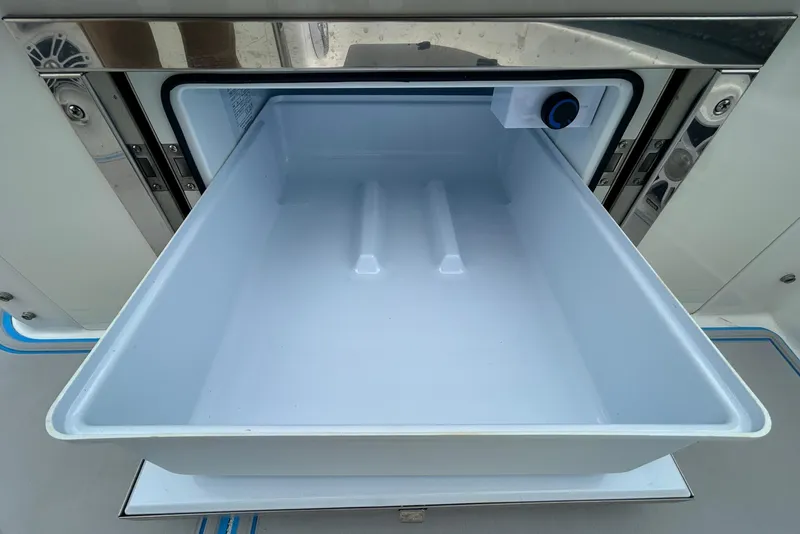 Slide: The Image of Open storage compartment on 2023 Regal 38 FXO boat, showcasing sleek design and functionality. - 37