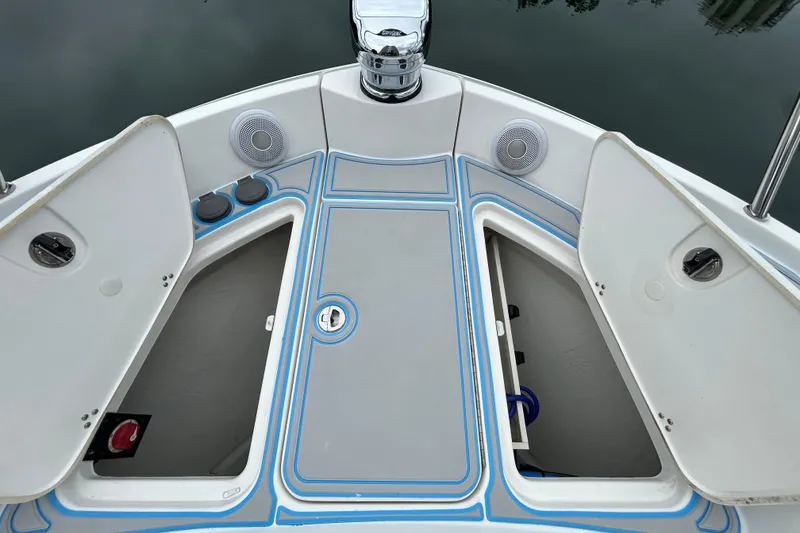 Slide: The Image of 2023 Regal 38 FXO boat deck with open storage compartments and speakers. - 42