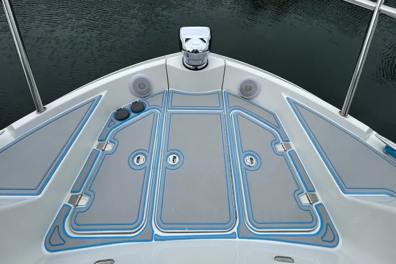 Slide: The Image of Bow deck of 2023 Regal 38 FXO boat with sleek design and speakers. - 41
