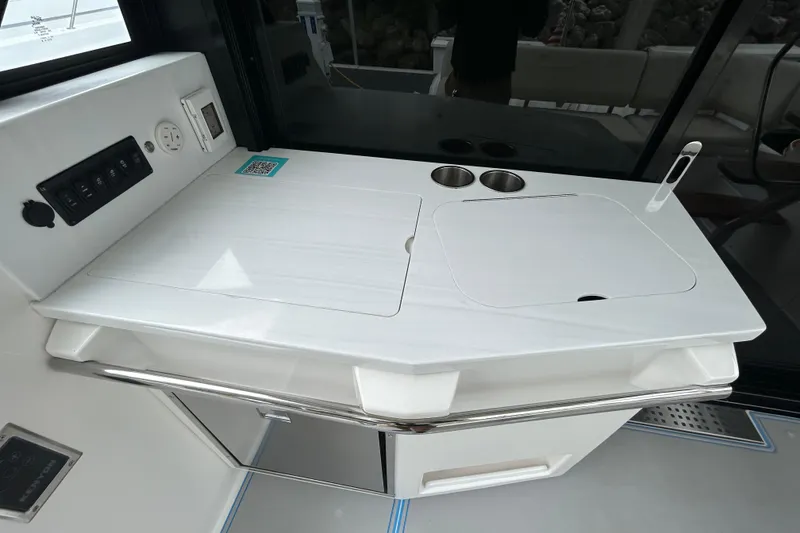 Slide: The Image of Modern kitchenette on 2023 Regal 38 FXO yacht with sink and control panel. - 48