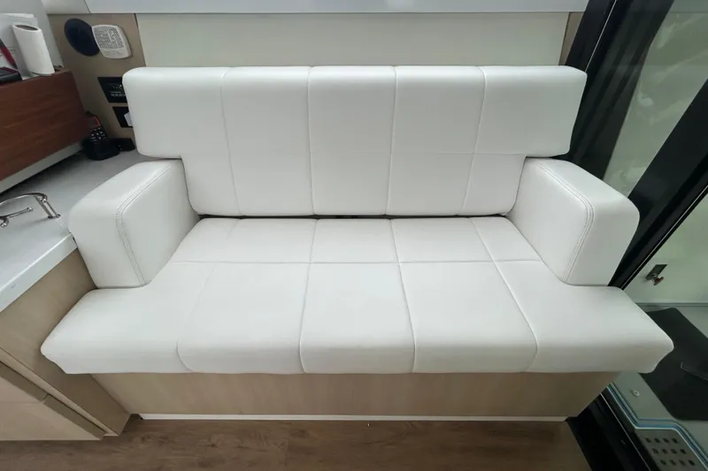 Slide: The Image of Luxurious white leather seating in 2023 Regal 38 FXO yacht interior. - 56