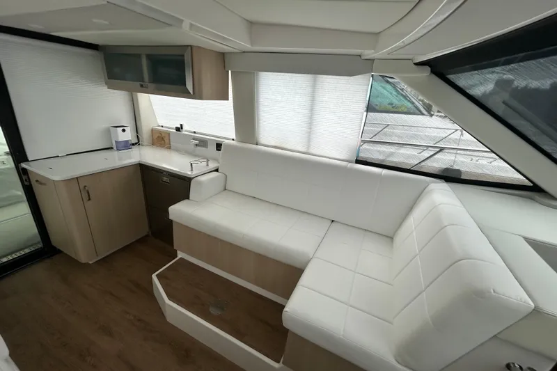 Slide: The Image of Luxurious interior of 2023 Regal 38 FXO yacht with white seating and modern cabinetry. - 77