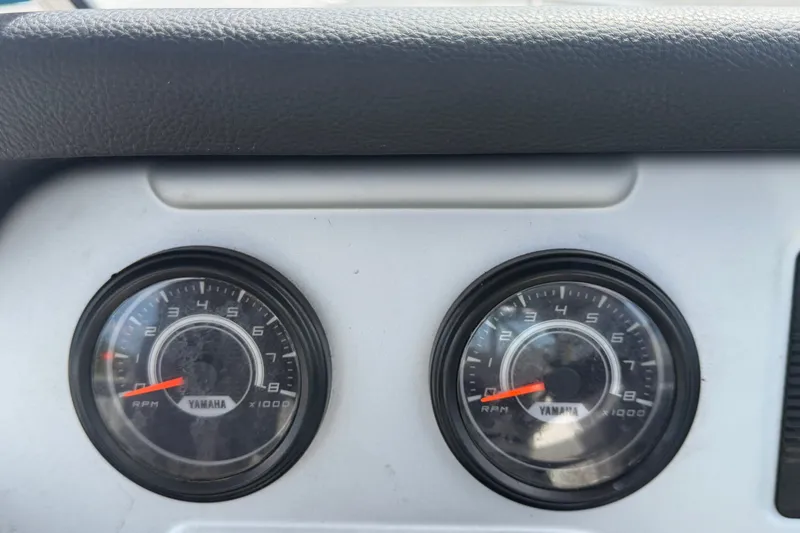 Slide: The Image of Close-up of 2022 Yamaha AR210 boat tachometers displaying RPM gauges. - 25