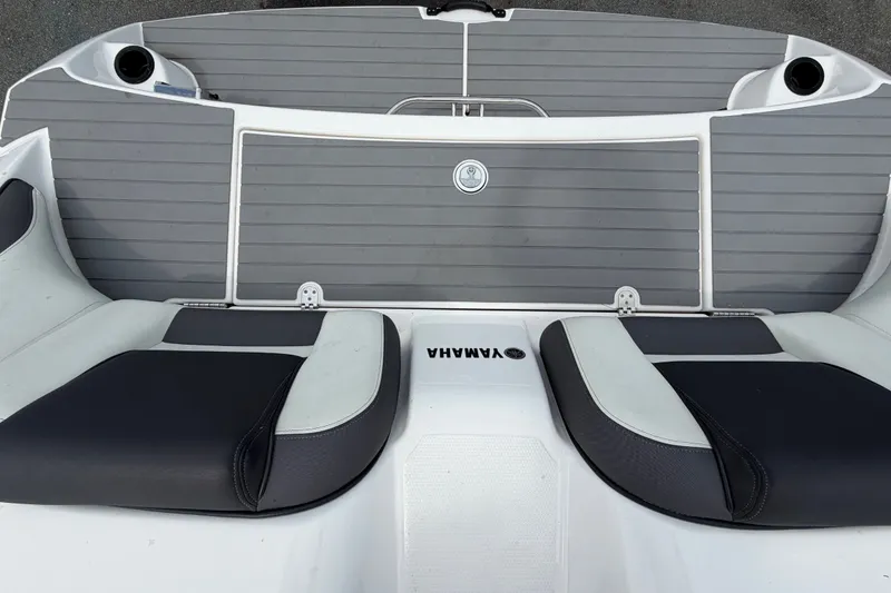 Slide: The Image of 2022 Yamaha AR210 boat deck with cushioned seating and sleek design. - 60