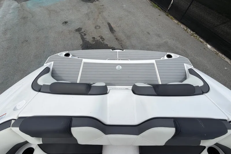 Slide: The Image of 2022 Yamaha Boats AR210 swim platform with cushioned seating and sleek design. - 58
