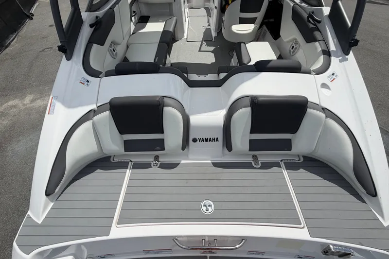 Slide: The Image of 2022 Yamaha Boats AR210 interior with sleek seating and modern design. - 11