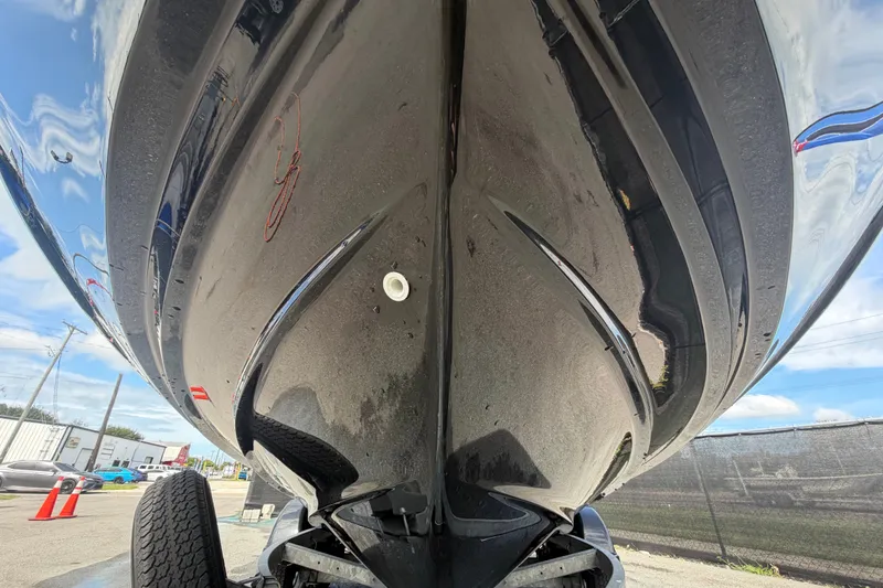 Slide: The Image of 2022 Yamaha Boats AR210 hull close-up, showcasing sleek design and glossy finish. - 9