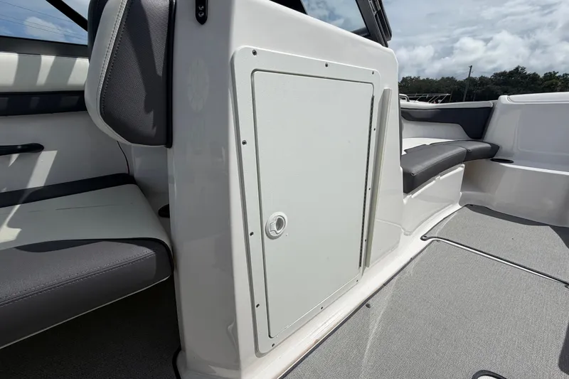 Slide: The Image of 2022 Yamaha Boats AR210 interior seating and storage compartment. - 33