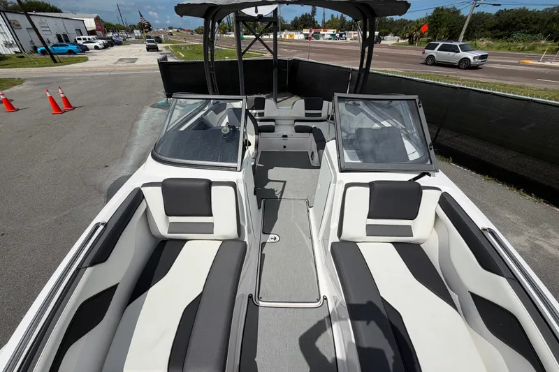 Slide: The Image of 2022 Yamaha Boats AR210 interior with sleek seating and modern design. - 43